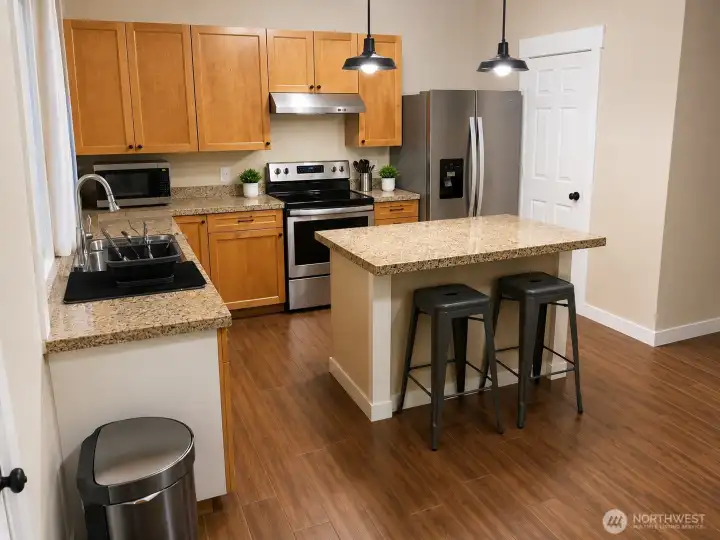 Main-level kitchen. Virtually staged.