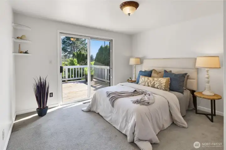 Primary bedroom with direct access to the upstairs bathroom and its own private deck.