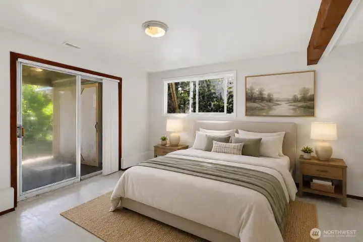 Virtually Staged lower level bedroom or rec room with a 3/4 bath right next to it.