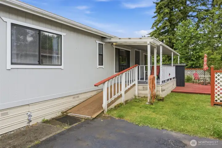 Front Covered Porch Leads inside and to Deck