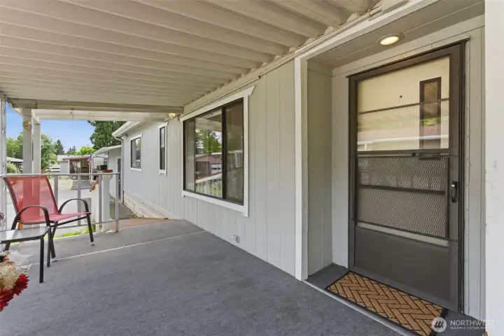 Covered Front Porch leads to front door with screen/storm door.