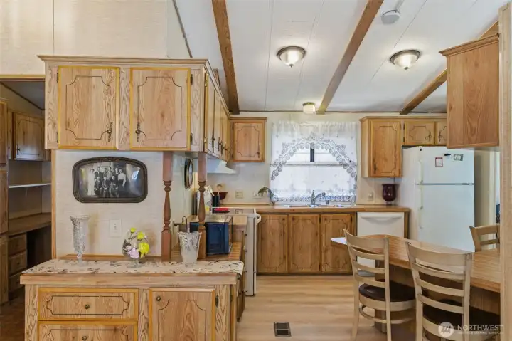 Serving Bar adjacent to the Kitchen makes Family Room movie nights more fun!