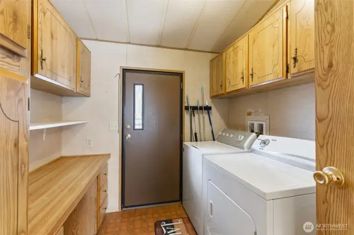 Laundry Room w/Washer and Dryer that stay! Built-in Cabinets and folding table.