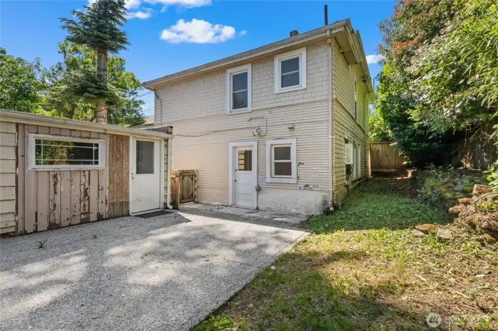Side of the home with the detached garage