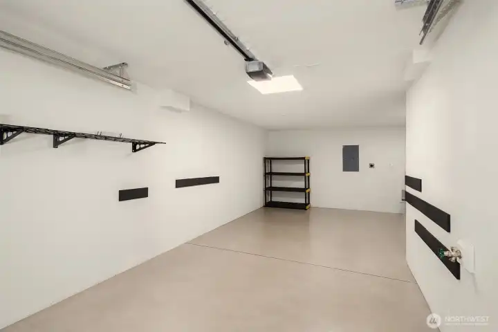 The private attached garage has an EV Charger and extra storage. The private attached garage has an EV Charger and extra storage.