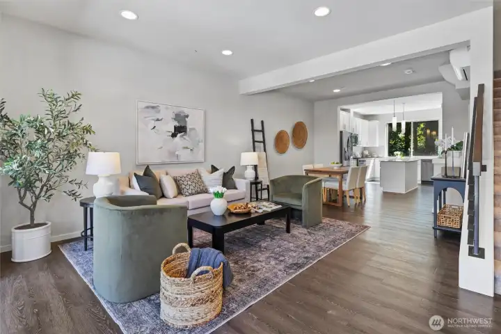 Wide-plank flooring, abundant natural light, and contemporary finishes define the spacious main living level. Wide-plank flooring, abundant natural light, and contemporary finishes define the spacious main living level.