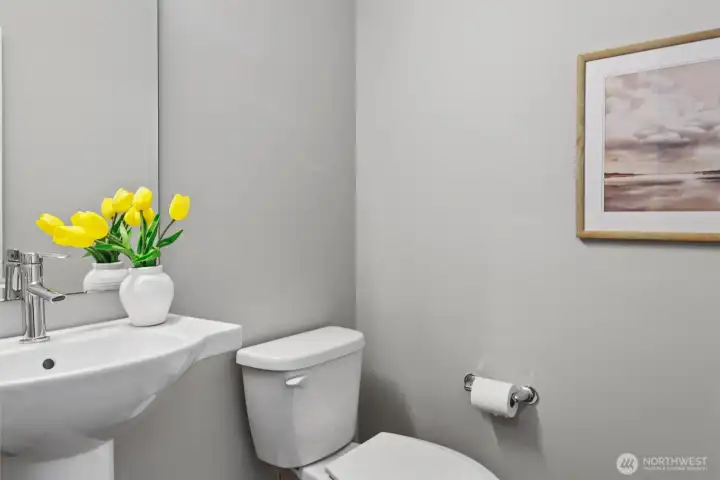 Main-level powder room provides added convenience for guests and entertaining. Main-level powder room provides added convenience for guests and entertaining.