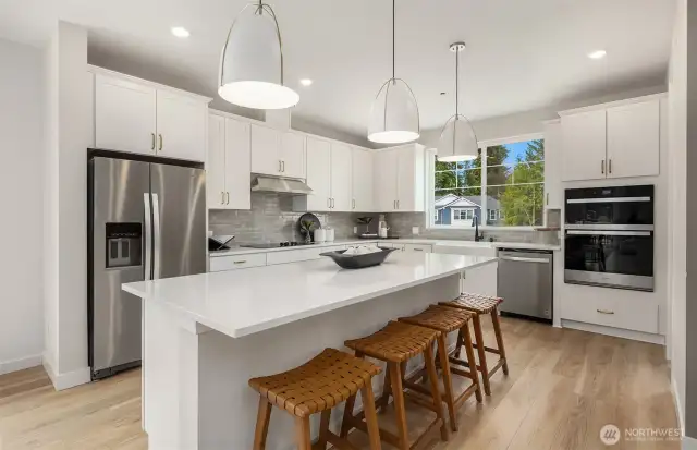 Stairs lead to spacious kitchen