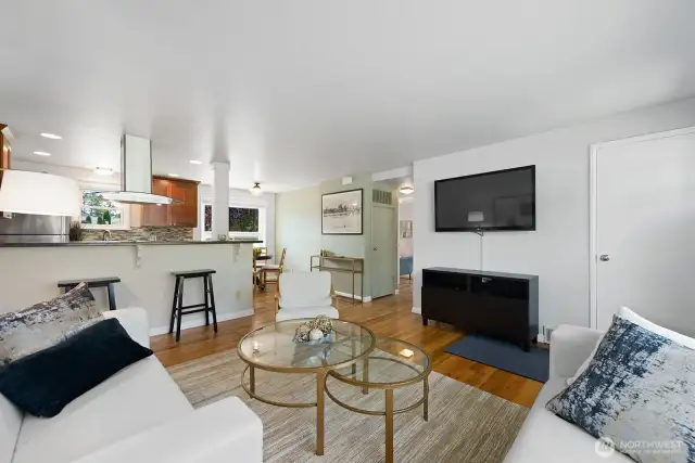 Off the dining area follow the hallway to two bedrooms and full bath. with hardwood floors through the bedrooms and hallway.