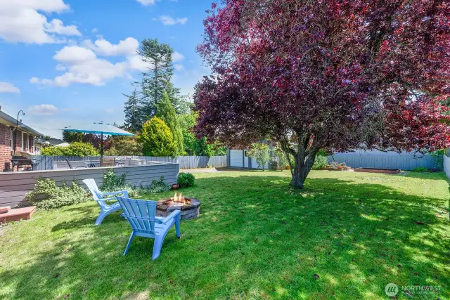 Fire pit on the lawn for those cool evenings. What a great spot to enjoy!