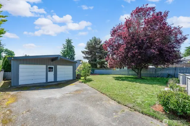 Big two car garage with man door between the bays. Possible future DADU? You decide.