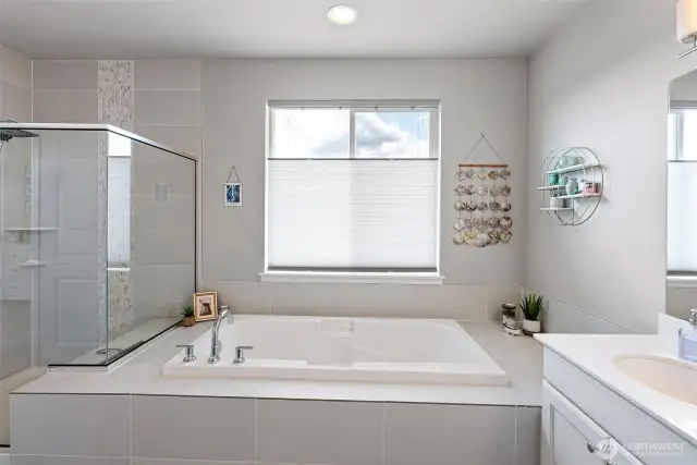 Soaking tub in primary suite