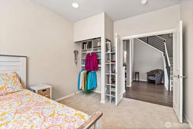 Main floor bedroom with custom closet & French doors
