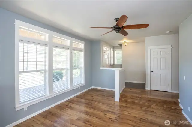 Living area features oversized windows that flood the space with natural light.