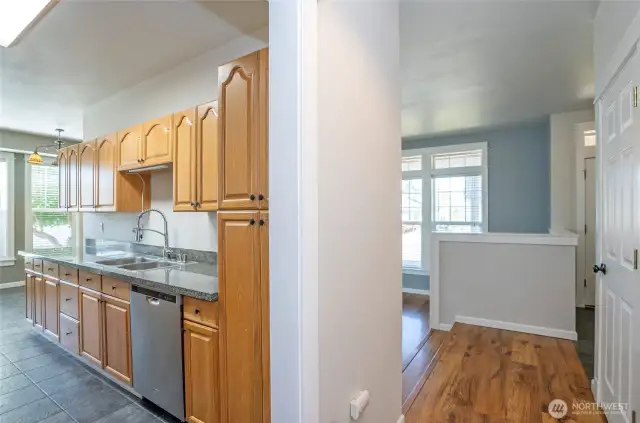 Clean sightlines from the hallway highlight the entry and beautifully connected kitchen area.