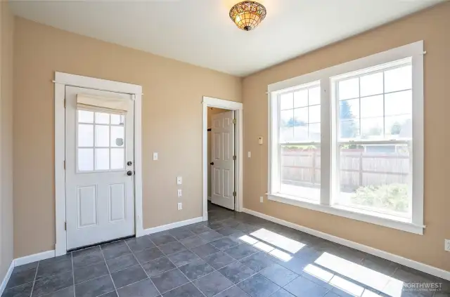 From this perspective, the den/office offers access to the deck on the left and the utility room on the right.