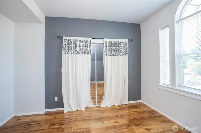 A second look at Guest Suite #2 upstairs, filled with natural light streaming through elegant windows.
