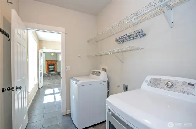 Main floor laundry/utility room offers easy garage access through a second door.