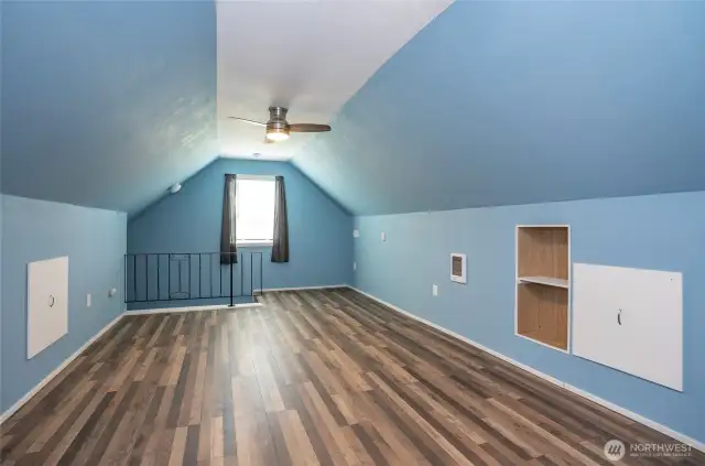 A different angle of the bonus room over the garage highlights its spacious layout.