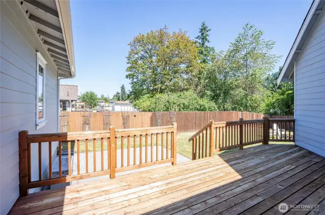 Step out from the den/office onto a roomy deck that flows into the patio and private outdoor space.