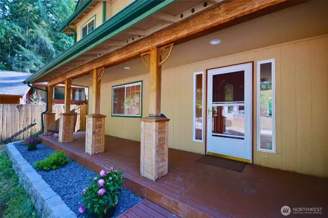 Front deck expands the front of home to sit and enjoy coffee, finished. with rustic detail
