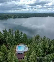 Community pool with hot tub and kiddy pool overlooking our beautiful lake.