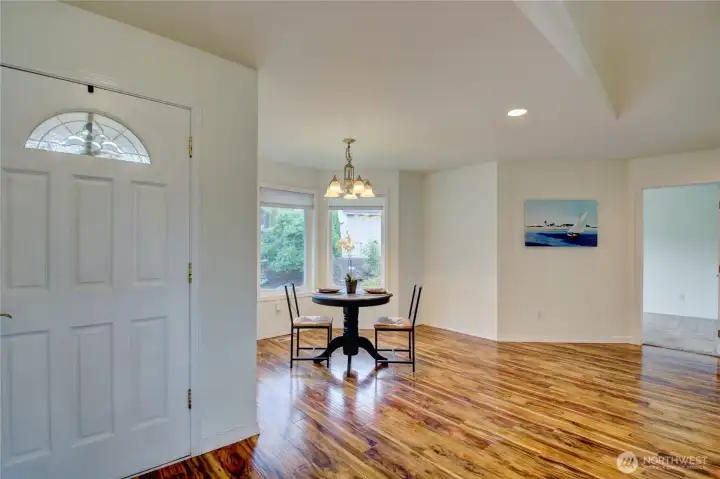 Main Entry opens to bright main floor living space at the heart of the home.
