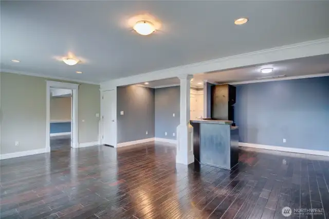 Bonus room with kitchenette. Doorway to upstairs creating a separate space.
