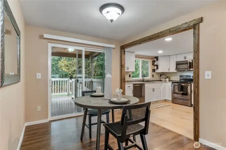 Dining room adjacent to kitchen with access to covered back deck