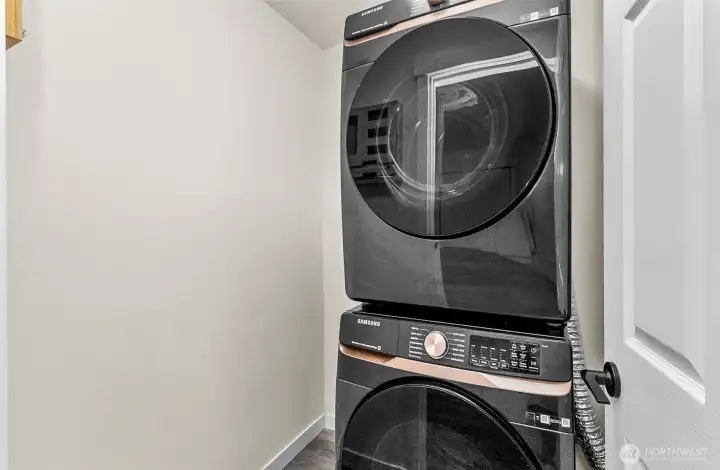 Nice new stackable large washer and dryer with plenty of room to add items you need in the laundry space