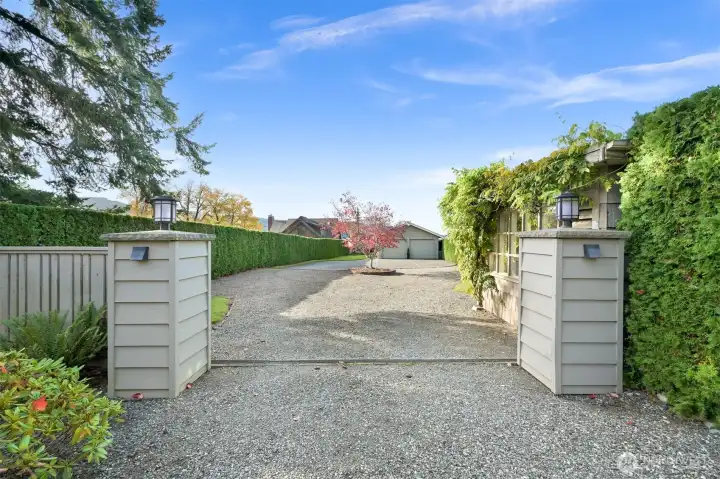 Gated entry with big circle driveway