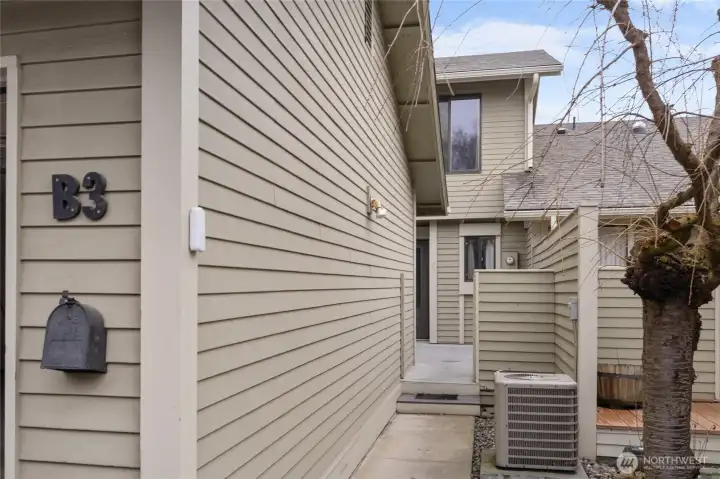 A private walkway leads you to an enclosed deck and the main entry.