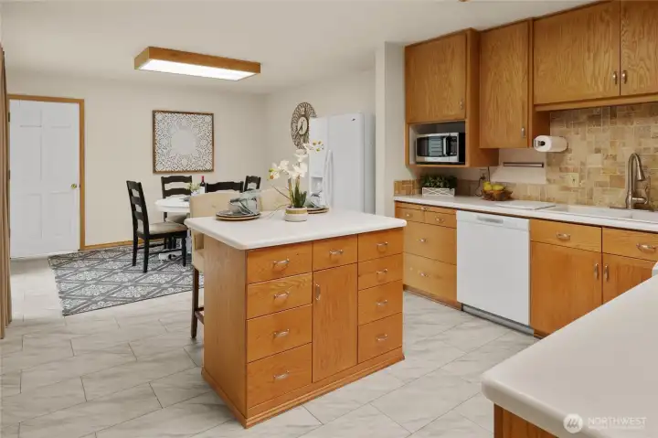 Eating space at both the island and the informal dining area.