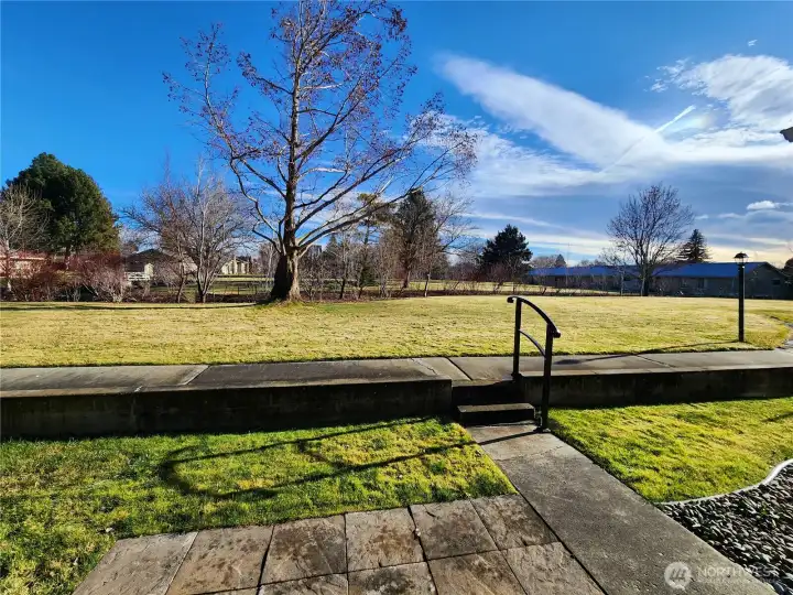 The concrete patio area at the front of the condo is a perfect spot to enjoy the summer sun and access to the common area.