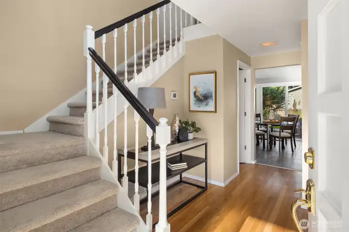 Welcome guests from the covered front porch into the entry with newly refinished hardwood floors and new carpet.