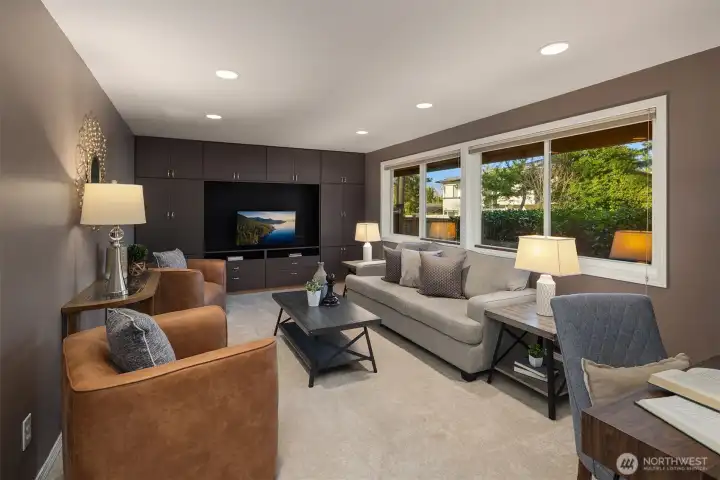 The main-level bonus room overlooks the backyard and offers excellent storage with custom built-ins.