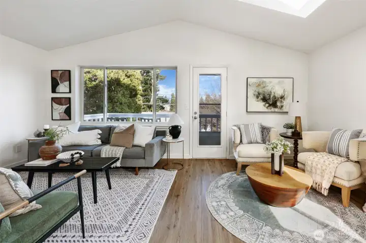 Vaulted ceilings with skylights, engineered hardwoods, plentiful natural light.