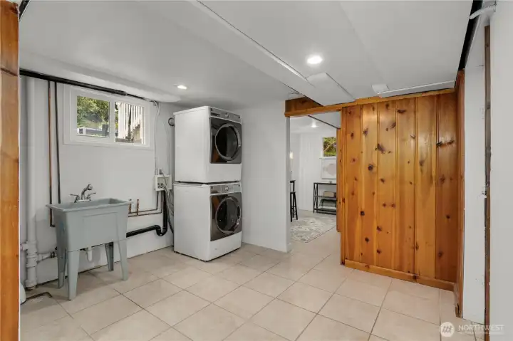 Laundry area leads to utility area, powder room and 4th bedroom (non-conforming)/office