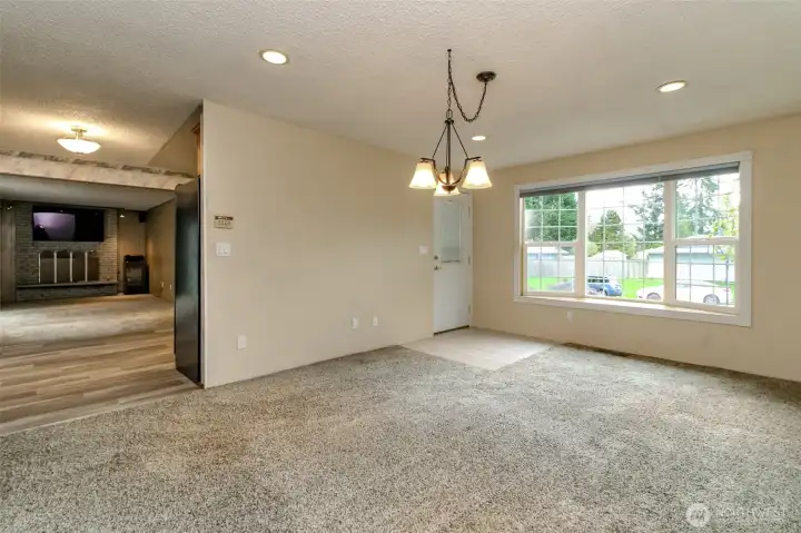 The living room has space for a formal dining room.