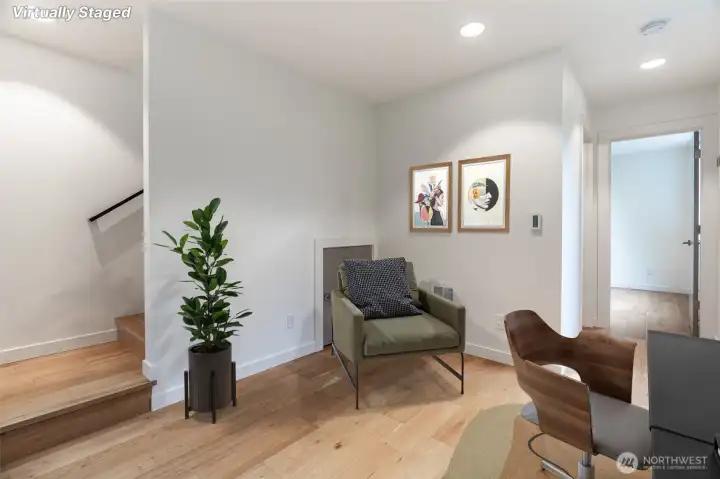 This corner could be used for another desk. Extra storage under stairs.