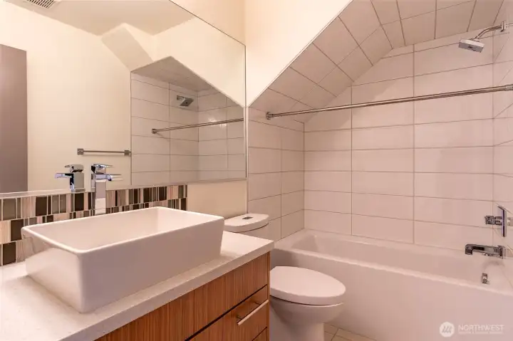 Full guest bath on main floor between office and bedroom.