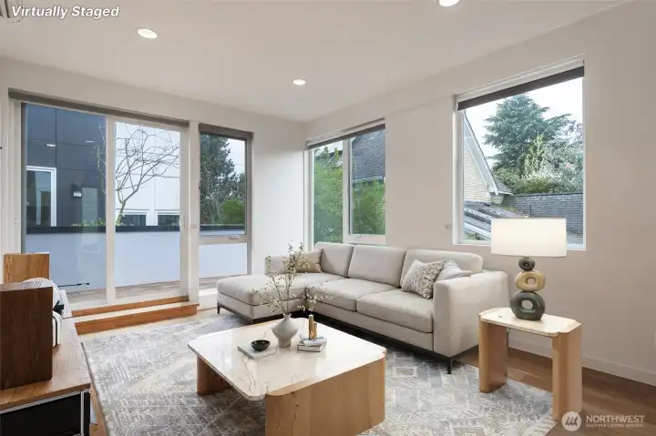 Living room has space to breathe with very tall ceilings.