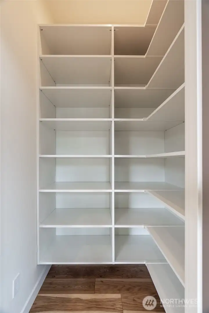 Walk-in pantry space for extra storage.