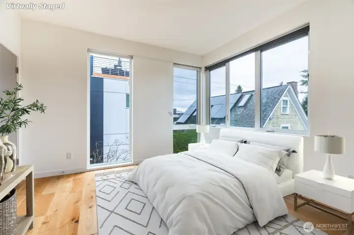 Primary bedroom is light and bright. Also with motorized windo coverings.