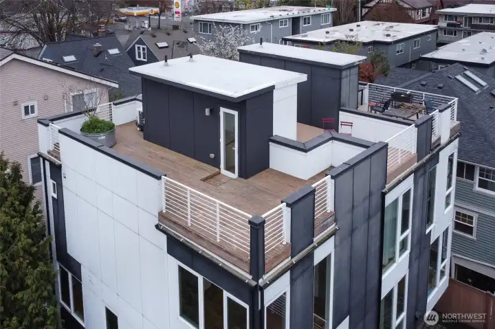 Rooftop deck is sizable and offers hot/cold water for urban gardening.