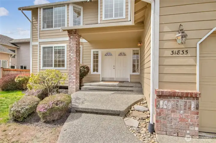 Covered front patio to double entry door!!