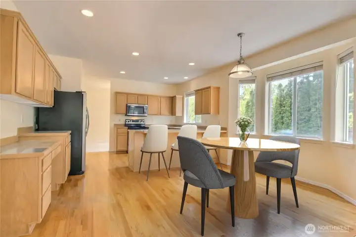 Eating nook to kitchen area - virtually staged
