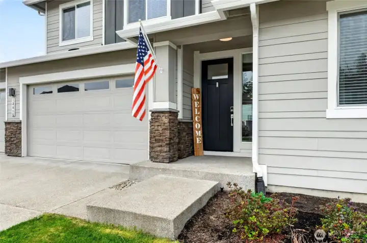 Welcoming front porch greets you.  Also, customizable, automated exterior lighting makes everyday feel like a celebration!