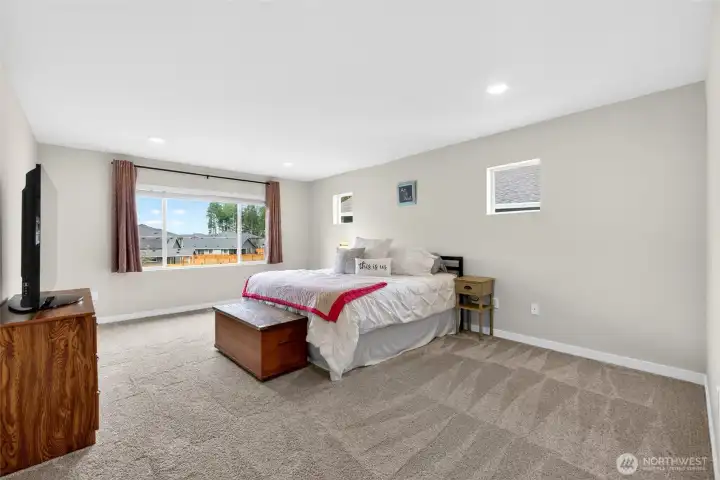 Retreat to the exquisite primary suite with spa-inspired bath and large custom closet