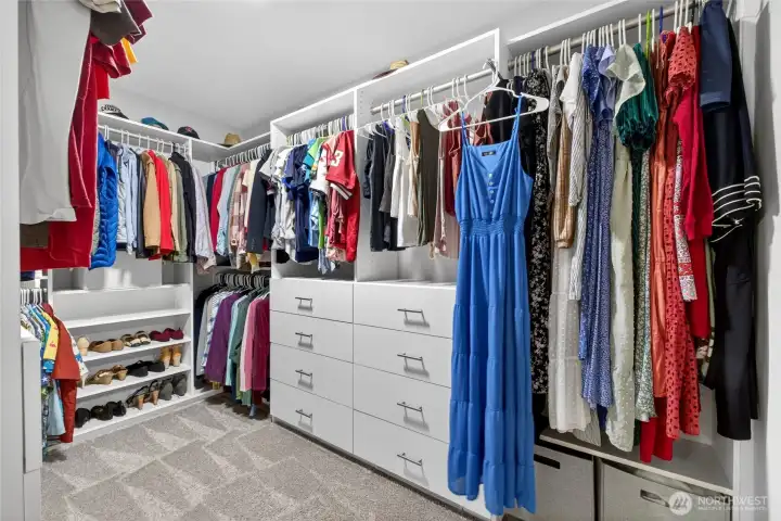 The spacious custom walk in closet offers exceptional organization